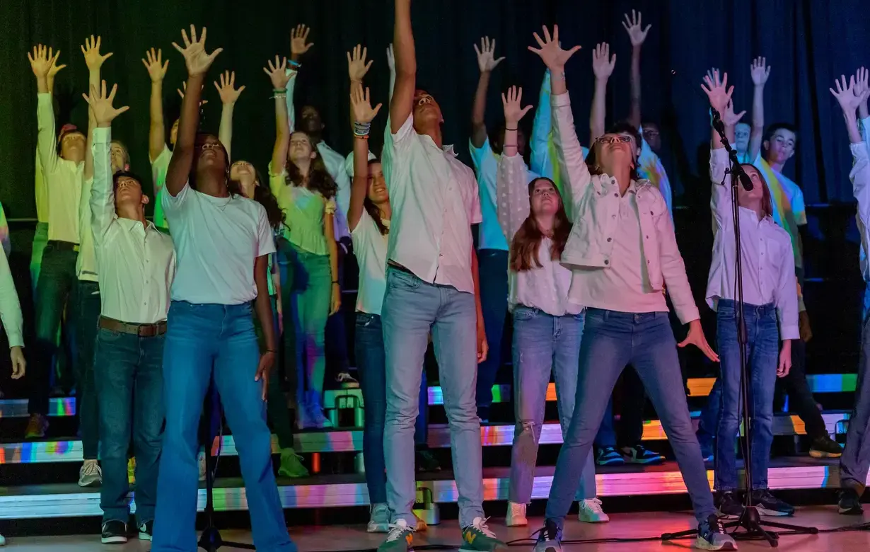 Trinity Lower School students performing show on stage