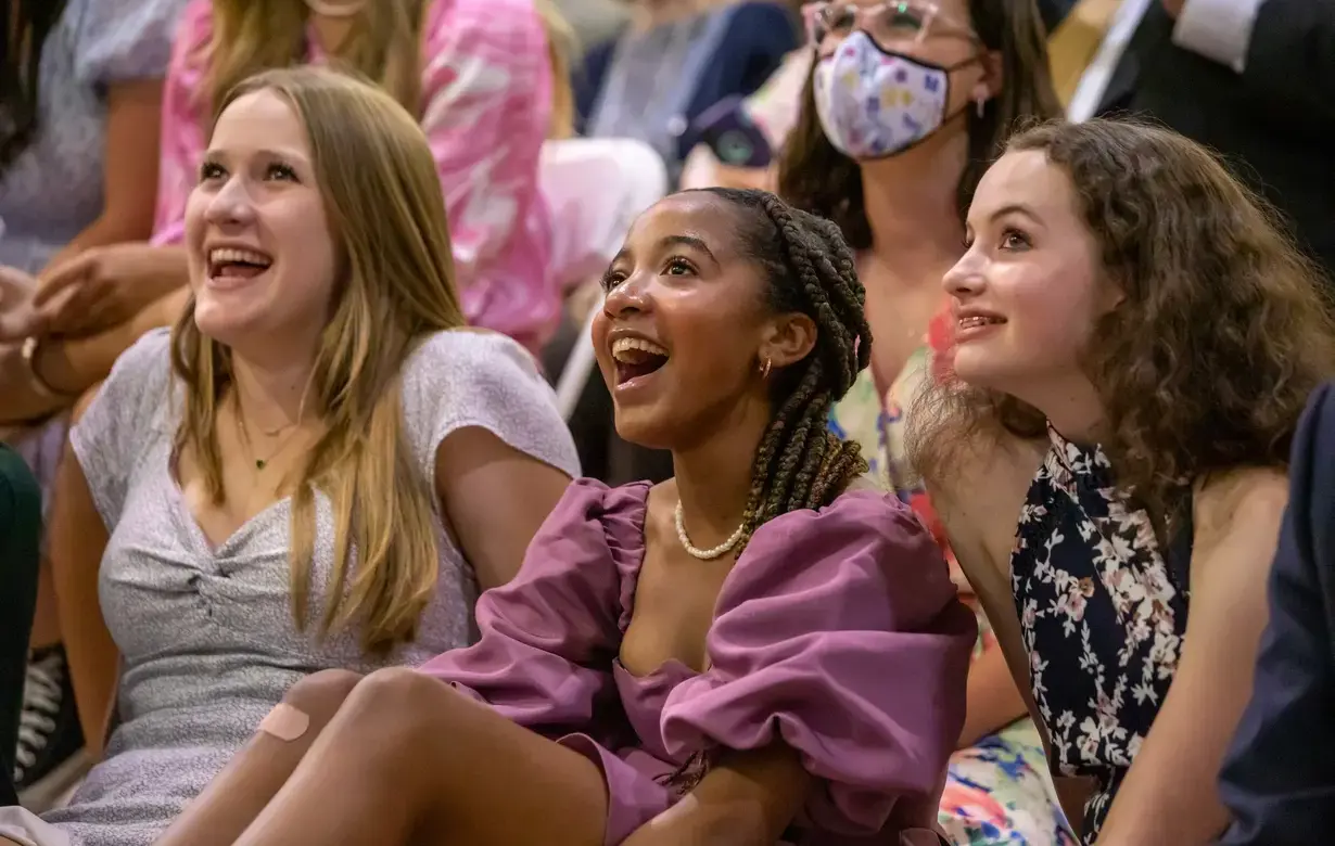 Three smiling middle school students