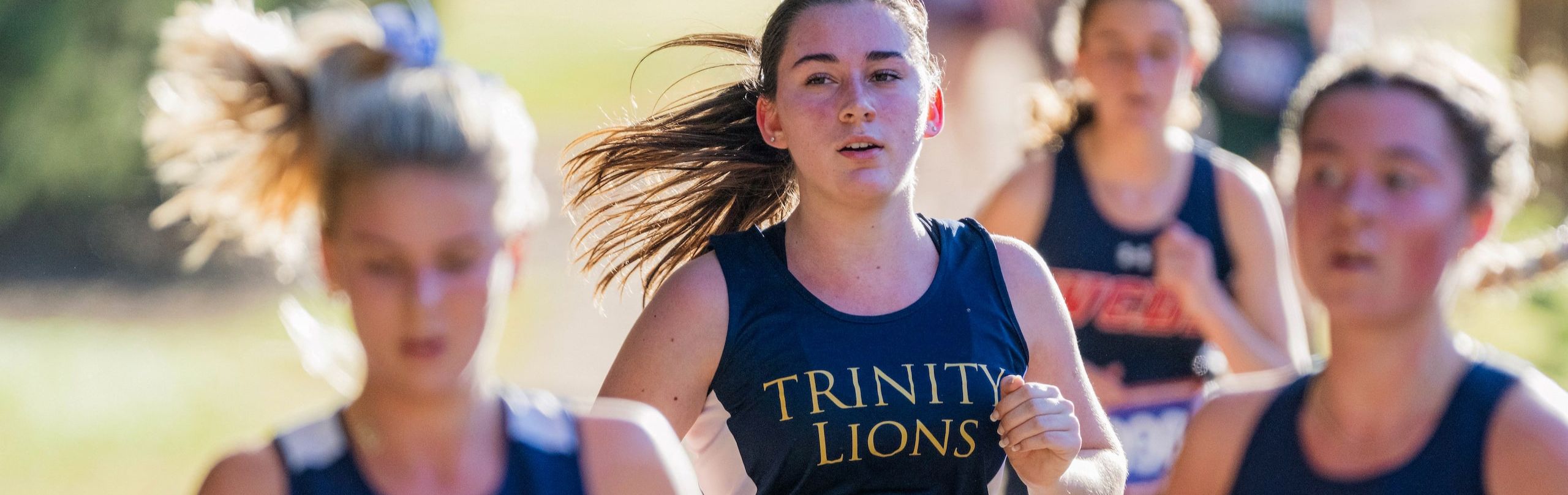 Female students running cross country