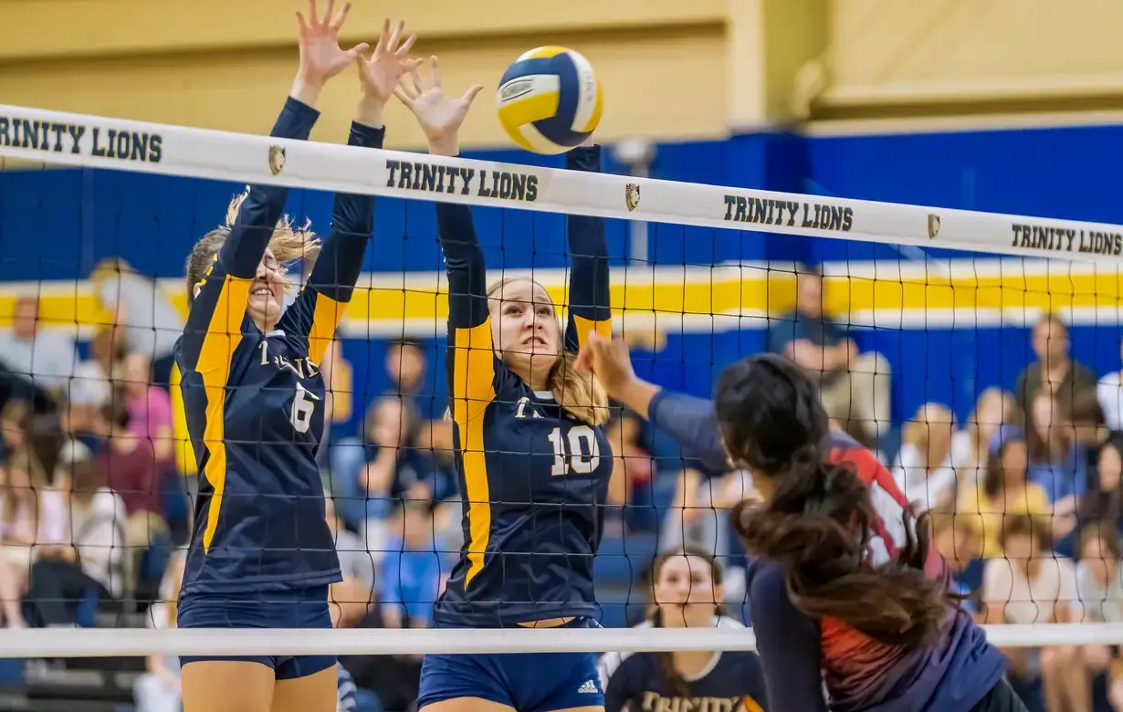 Female students playing volleyball