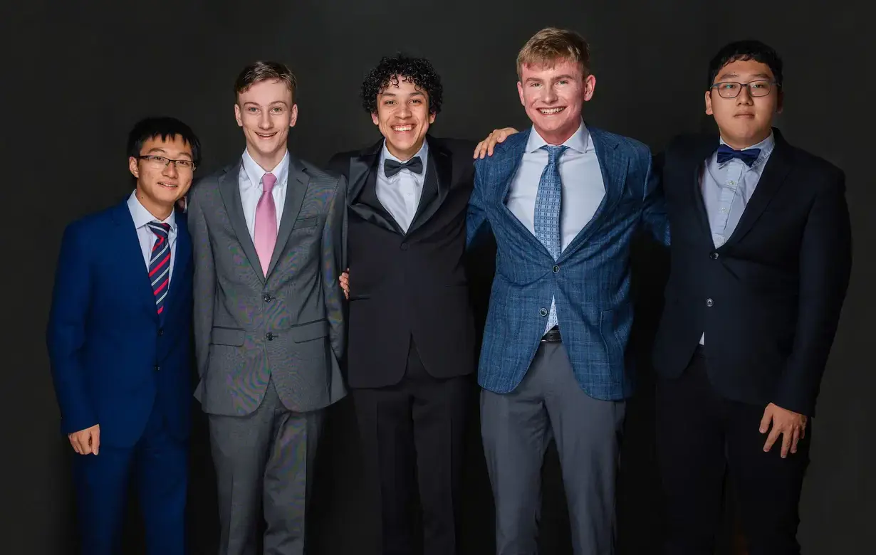 Group of male international students dressed in formal attire