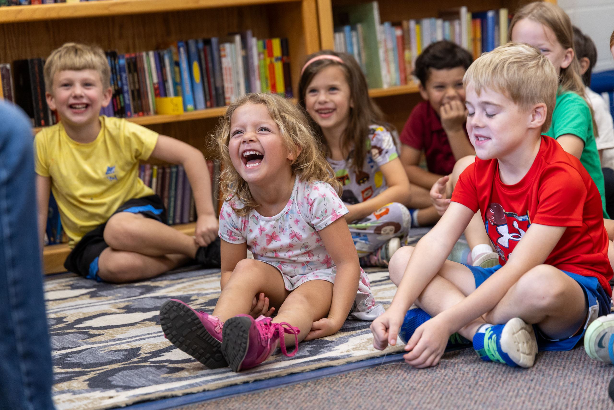 Lower School students laughing during story time